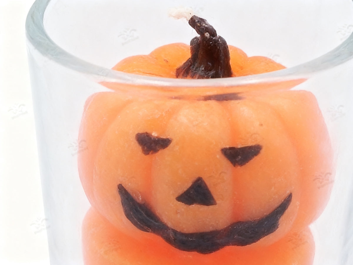 Vela de Calabaza Sonriente en Vaso